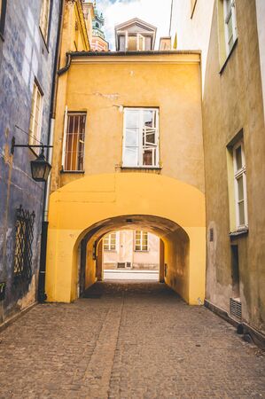 Narrow streets in the old part of the city between colourful historical buildingsの写真素材
