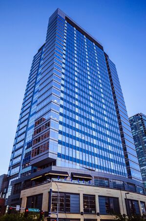 Modern skyscraper in the downtown with clear blue sky on the backgroundの写真素材