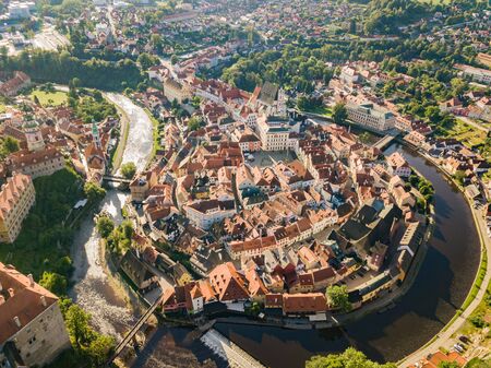 Early sunny morning in a small european city surrounded by riverの写真素材
