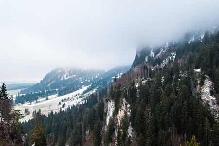 Foggy morning in the mountains in winterの写真素材