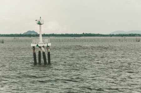 Standing almost dry  navigation device as a symbol of water resources issueの写真素材