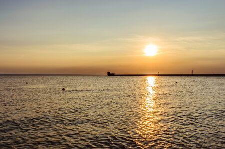 Spectacular sunset over the sea shoreの写真素材
