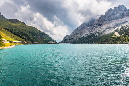 Beautiful mountain lake in Dolomites with heavy clouds on the backgroundの写真素材