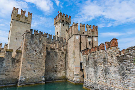 Rocca Scaligera castle surrounded by water of Lago Di Garda in Sirmioneのeditorial素材