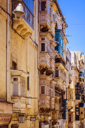Valletta, Malta - June 20, 2019 - traditional detail of Maltese architecture - small balconies painted in different colorsのeditorial素材