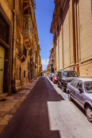 Valletta, Malta - June 20, 2019 - beautiful street in the historical part of the city in summer, under the blue skyのeditorial素材