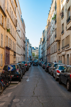 Paris, France - Apr 19, 2019 - Heavily parked narrow street in the historical part of the cityのeditorial素材