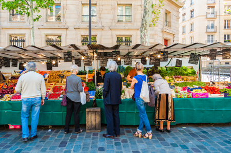 Paris, France - Apr 20, 2019 - Traditional food market in Paris during sunny morningのeditorial素材