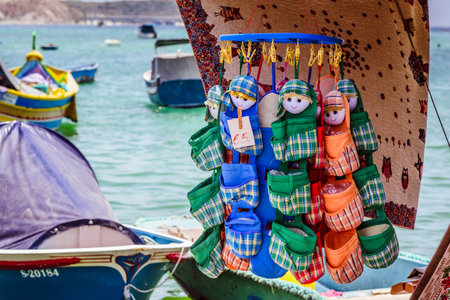 Marsaxlokk, Malta - June 22, 2019 - colorful phone pockets on the souvenir market on Maltaのeditorial素材