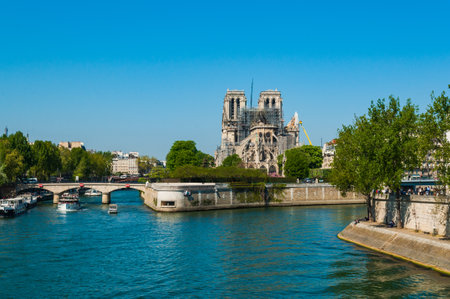 Paris, France - April 20, 2019 - Famous Notre Dame cathedral just after the fire. The very beginning of reconstruction workのeditorial素材