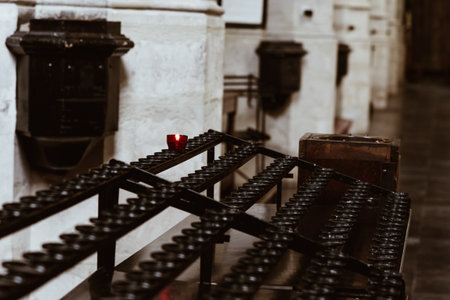 Single red candle on the stand in the cathedralの写真素材