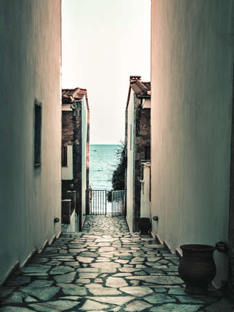 A small pass between the walls which goes to the beach.の写真素材