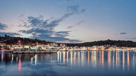 Panorama of town Nea Skioni, Kassandra, Greece. Beautiful sunset at Nea Skioni, view from port.の写真素材