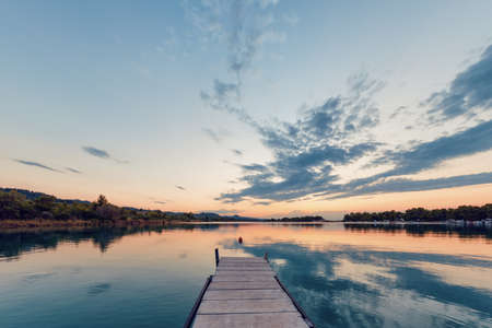 Sunset over the boat harbor. Boat harbor at sunset, peninsula Kassandra, Halkidiki, Greece.の写真素材