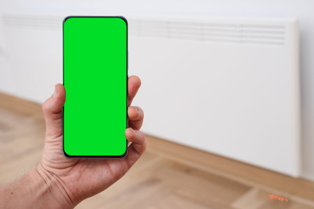 Smart heater convector control by phone app. Smart Home with the smart heating system. Electric...
