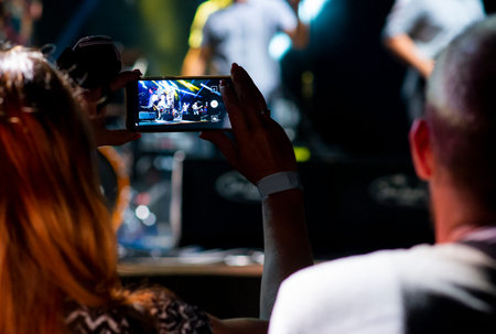 Video recording of the concert on the smartphoneの写真素材
