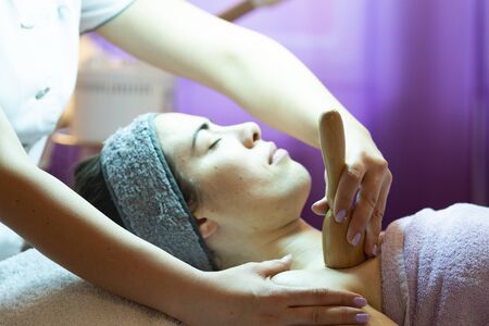 Woman getting Thai massage from professional masseuseの写真素材