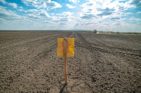 Tractor spreading artificial fertilizers. Transport, agricultural.の写真素材