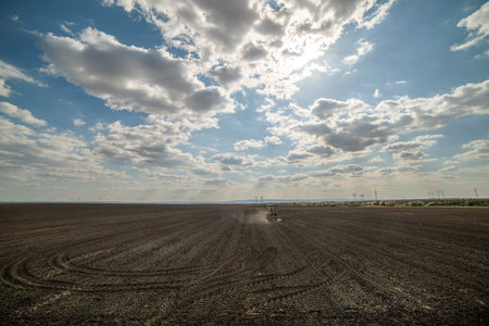 Tractor spreading artificial fertilizers. Transport, agricultural.