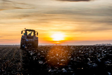 Tractor plowing fields -preparing land for sowingの写真素材