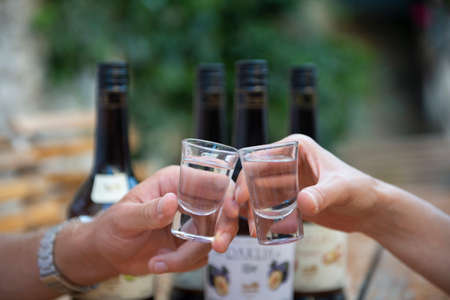 Bless you! Knocking glasses with brandyの写真素材