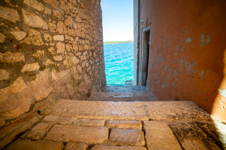 Passage to the Adriatic Sea in the town of Rovinj. Istrian Peninsula, Croatia.の写真素材