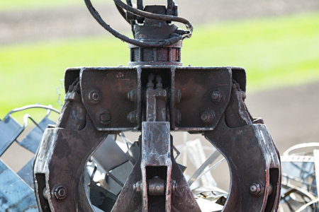 Crane grabber loading metal scrapの写真素材