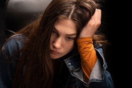 Portrait of a teenage girl who thinks she is unhappy. Bad emotion.の写真素材