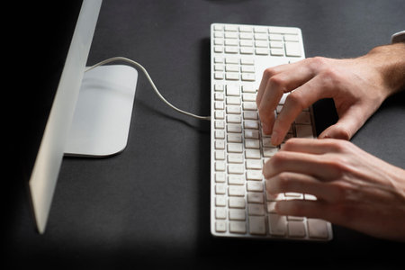 Business, education, programming, people and technology concept - typing male hands on keyboard