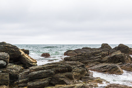 rocky beach on the seashore in cloudy day, nature series. Cape Acute. South Sakhalin, Russiaの写真素材