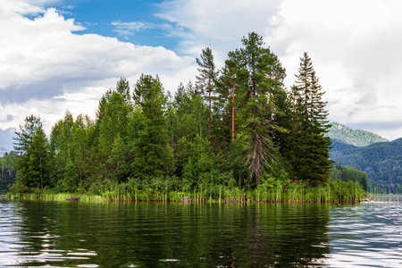 Scenic view of a beautiful lake in the middle of the forest. Landscapes of Lake Tagasuk. Islands on the lake. Siberia, Russiaの写真素材
