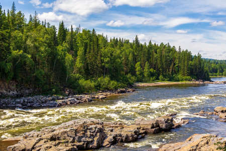 View of the raging rapids of the Kazyr River. Near Kuragino, Russiaの写真素材