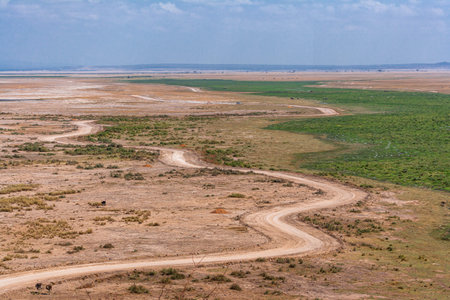 A view of the plains and waters from a low hill. Kenya, Africaの写真素材