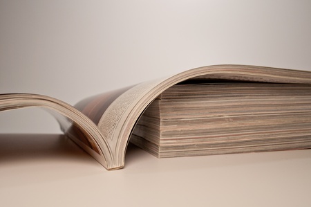 magazine on a stack of magazinesの写真素材