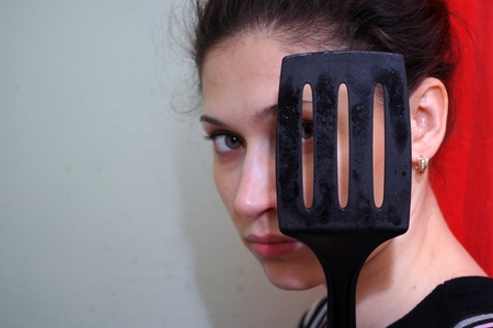girl with a spatula  for the meatの写真素材