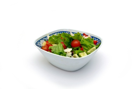 Vegetable salad from cucumbers, pepper, tomatoes, onionsの写真素材