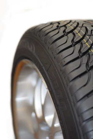 Low-profile car wheel on a white background 