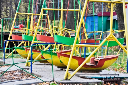 swing boats in the old amusement parkのeditorial素材