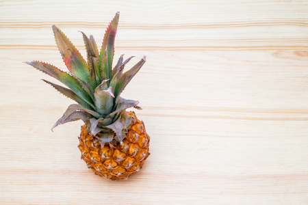 the fresh pineapple on the wooden tableの写真素材