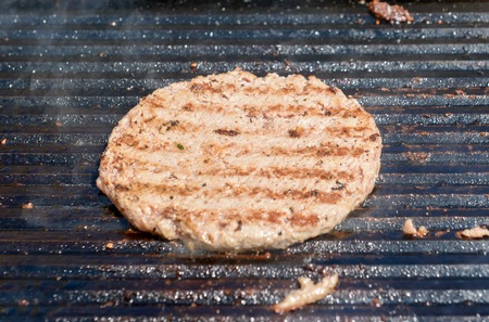 succulent grilled steak on a hot grillの写真素材