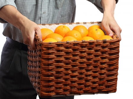 hands keep box of oranges on a white backgroundの写真素材