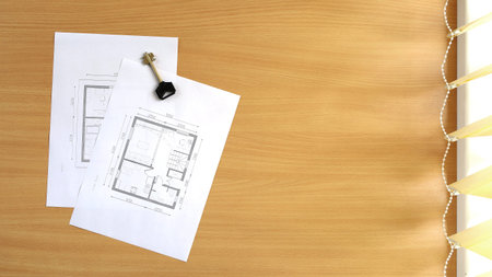 Floor plan of the house is located on the table. Top view with copy spaceの写真素材