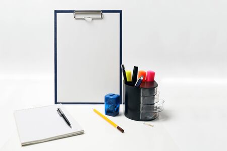 Mockup clipboard with other writing instruments on white background with copy spaceの写真素材