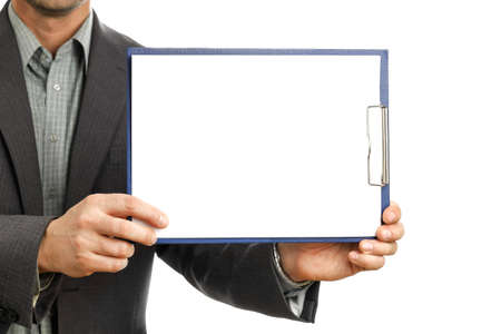 Businessman in suit holds clipboard and shows on it mockup, place for text and presentation, isolated on white background close-upの写真素材