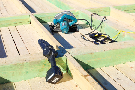 Disc and chain power tools, it is convenient to work with wooden materials, real construction of...