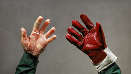 Concept protection of hands, safety agitation poster in industry, lasting protective red glove against hand from meat on skinの写真素材