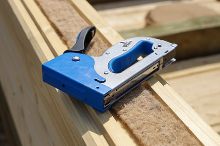 Construction stapler for fixing material, on the surface of juteの写真素材