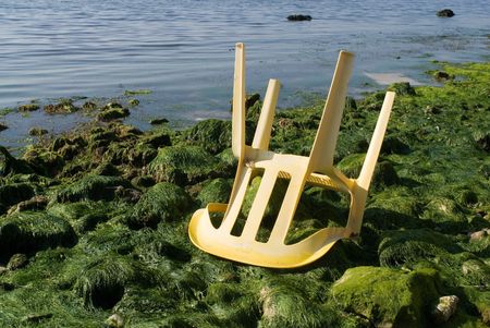 Broken chair at the beachの写真素材