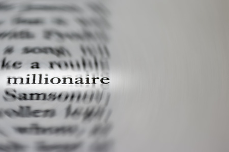 Macro photograph of the word millionaire - conceptの写真素材
