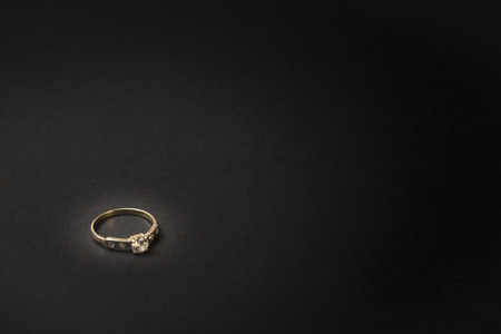 Proposal ring on a wooden tableの写真素材